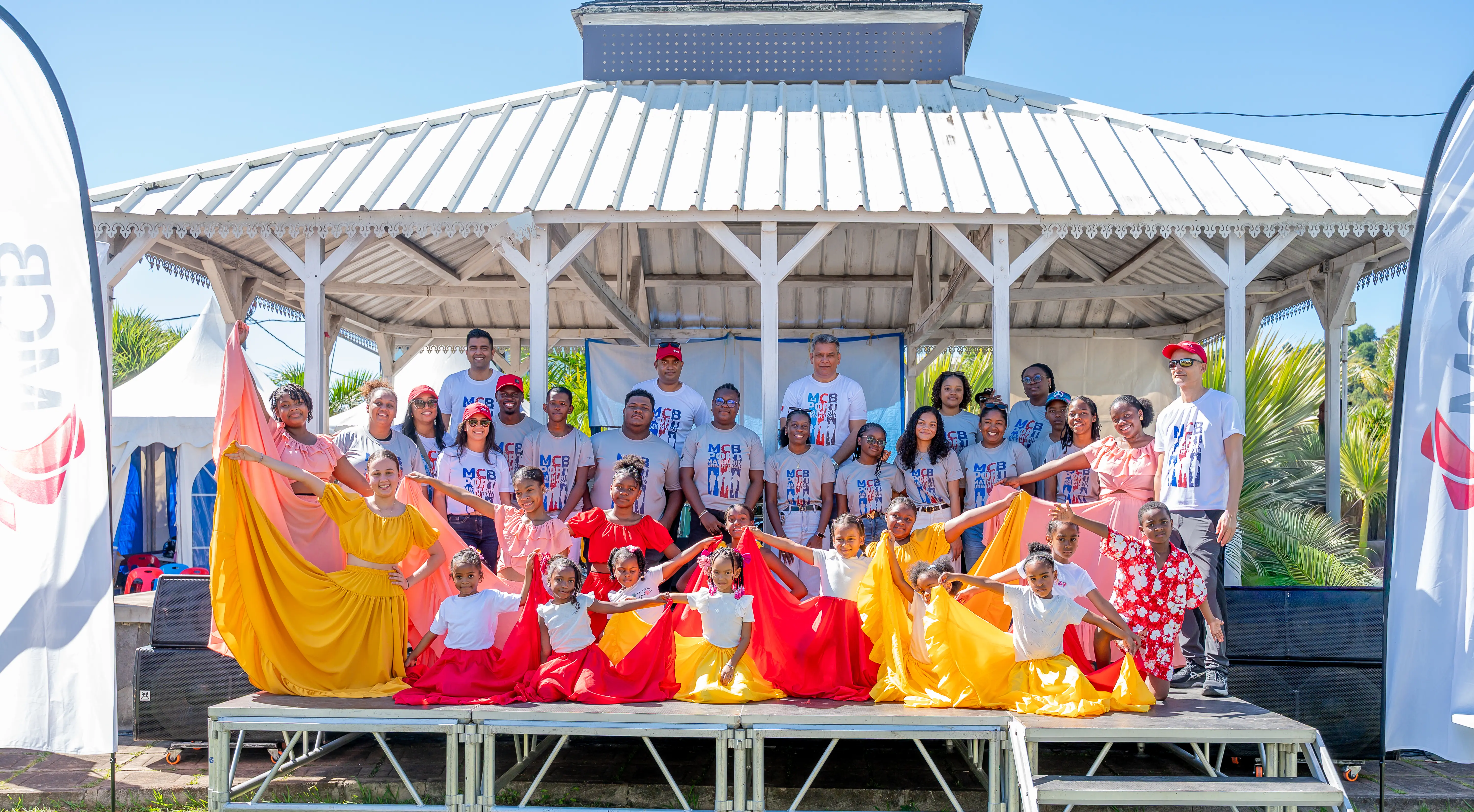 MCB representatives with children from the Skool of Art association